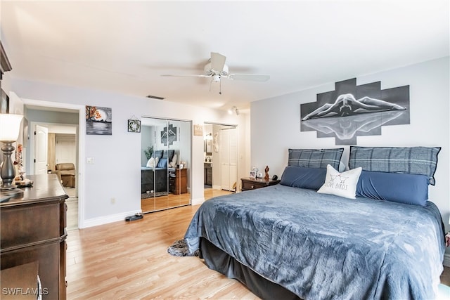 bedroom featuring light hardwood / wood-style flooring, a closet, and ceiling fan