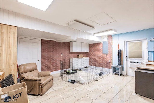 interior space featuring brick wall and electric panel