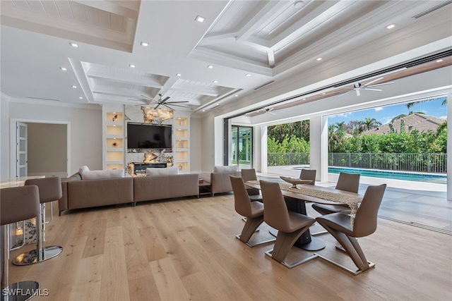 dining area featuring coffered ceiling, beamed ceiling, light hardwood / wood-style flooring, crown molding, and built in features