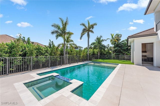 view of pool featuring a patio area and an in ground hot tub