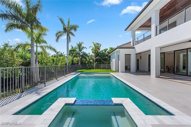 view of pool featuring an in ground hot tub and a patio area