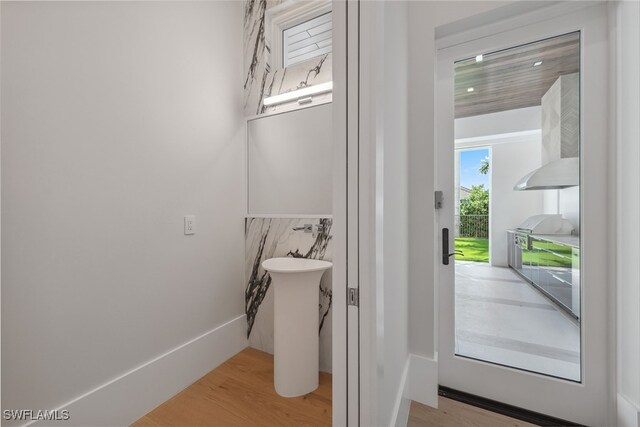 bathroom with hardwood / wood-style flooring