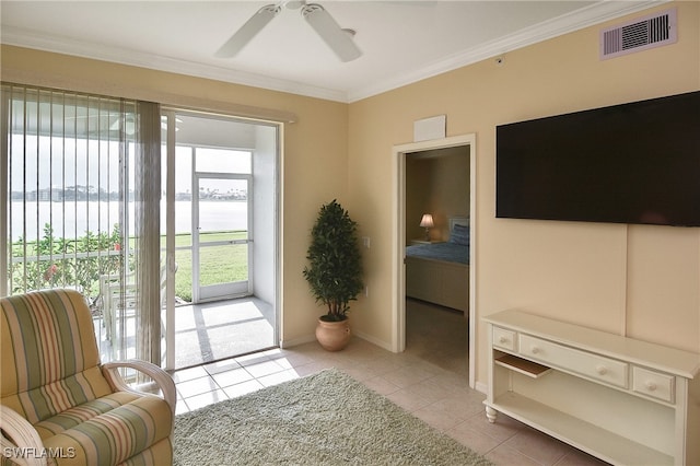 doorway to outside featuring ornamental molding, ceiling fan, a water view, and light tile patterned floors