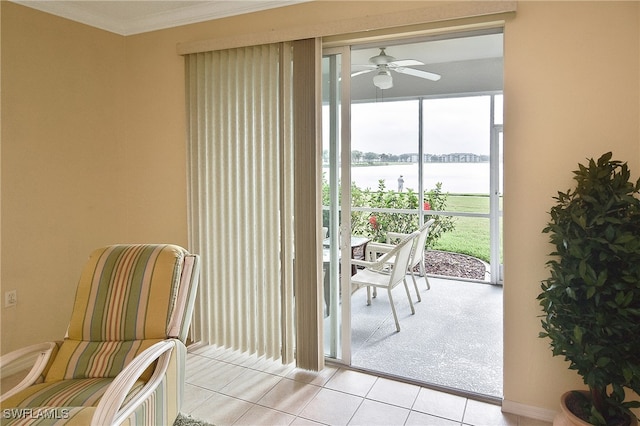 doorway to outside featuring ornamental molding, light tile patterned floors, a wall of windows, a water view, and ceiling fan