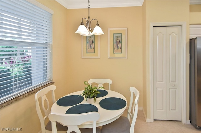 tiled dining area with crown molding and a chandelier