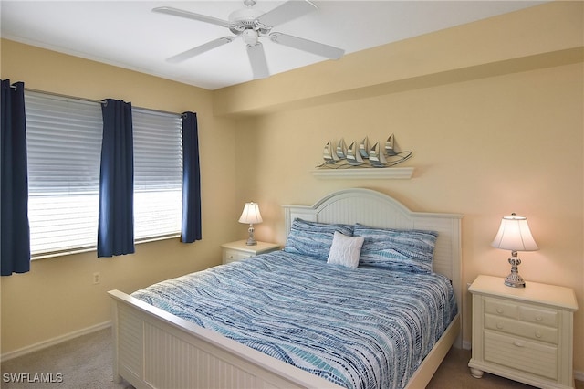 bedroom featuring ceiling fan and carpet