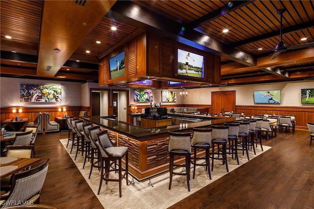 bar featuring wooden walls, wood-type flooring, and wooden ceiling