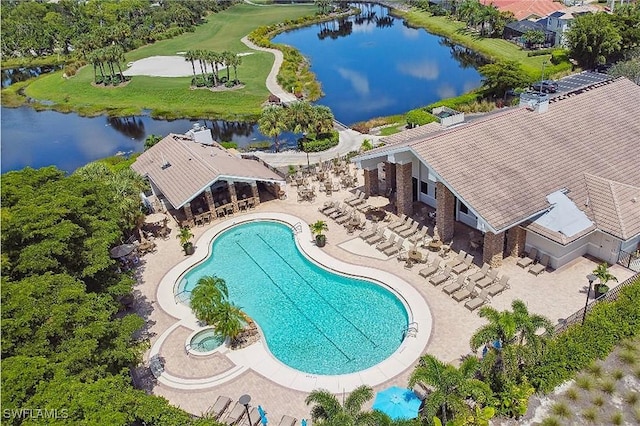 view of pool featuring a patio and a water view