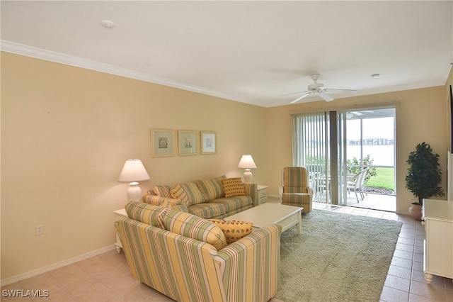 tiled living room with ornamental molding and ceiling fan