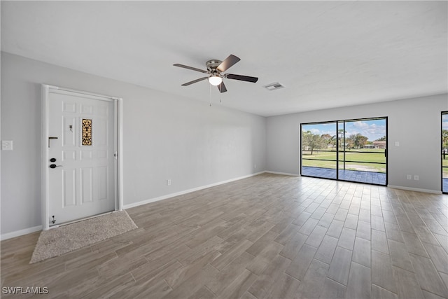 unfurnished room featuring ceiling fan and light wood-type flooring