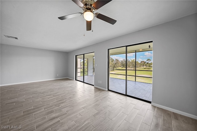 unfurnished room featuring light hardwood / wood-style floors and ceiling fan