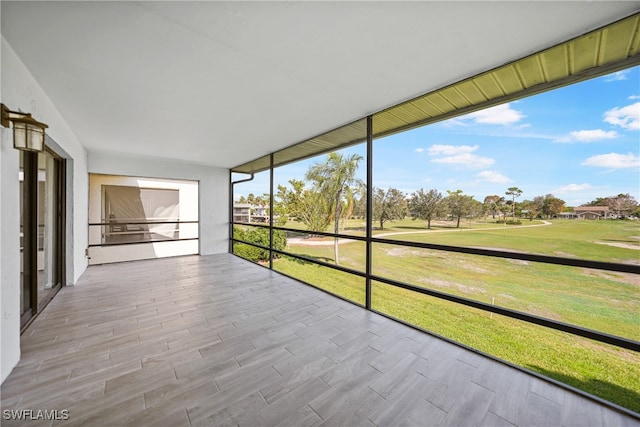 unfurnished sunroom featuring a healthy amount of sunlight