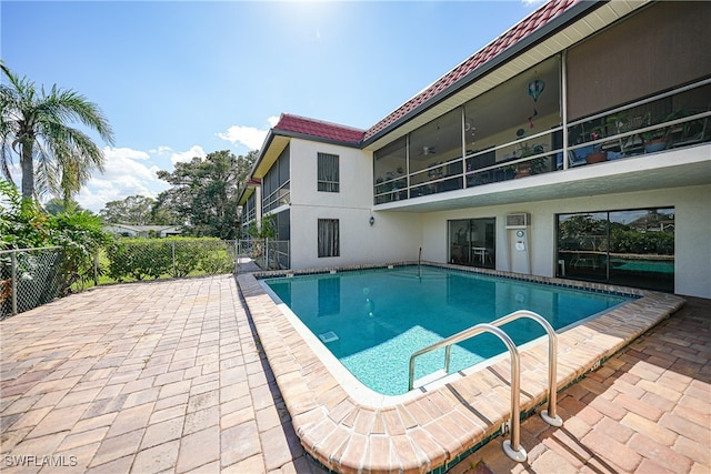 view of swimming pool featuring a patio