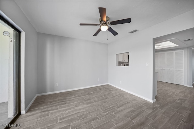 empty room with wood-type flooring and ceiling fan