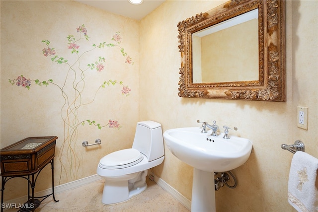 bathroom featuring toilet