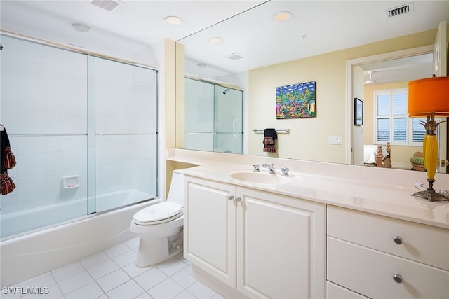 full bathroom with toilet, vanity, tile patterned floors, and shower / bath combination with glass door