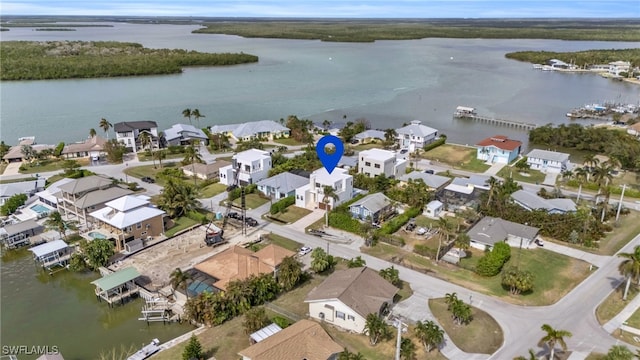 bird's eye view featuring a water view and a residential view