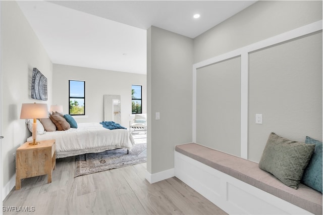 bedroom featuring baseboards, recessed lighting, and light wood-style floors