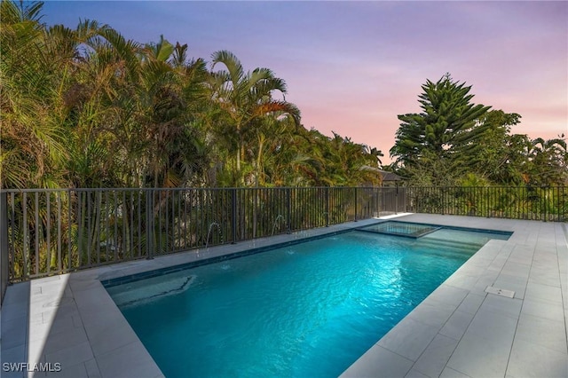 view of pool with a patio, fence, and a fenced in pool