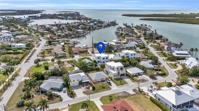 bird's eye view featuring a water view and a residential view