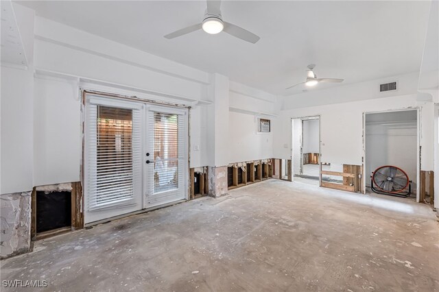 2472 Harbor Rd, Naples, FL 34104 - unfurnished living room with ceiling fan, unfinished concrete flooring, and a fireplace