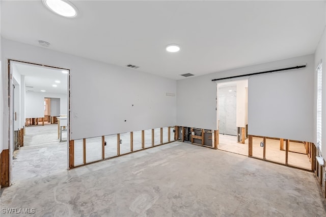 2472 Harbor Rd, Naples, FL 34104 - unfurnished room featuring unfinished concrete floors and a smoke detector