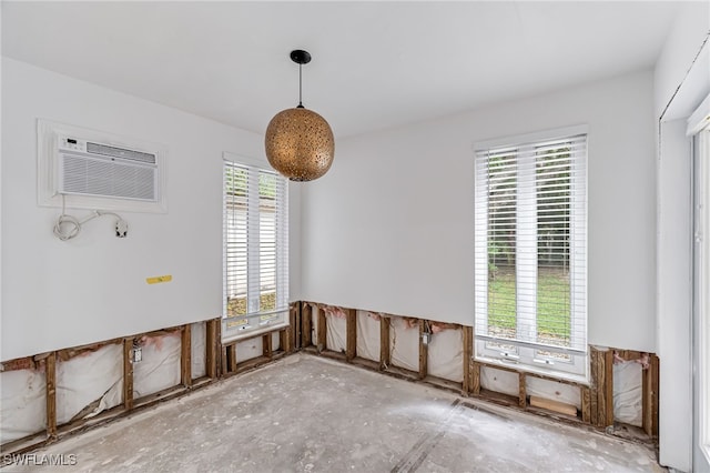 2472 Harbor Rd, Naples, FL 34104 - unfurnished room featuring plenty of natural light and an AC wall unit