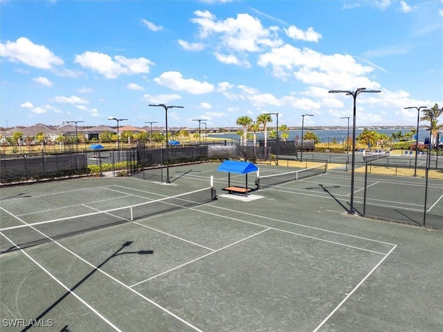 view of sport court with fence