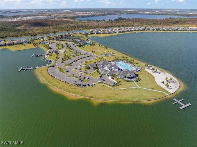 birds eye view of property with a water view