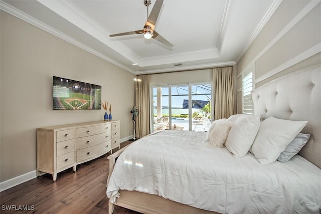 bedroom featuring a raised ceiling, ornamental molding, access to outside, dark wood-type flooring, and ceiling fan