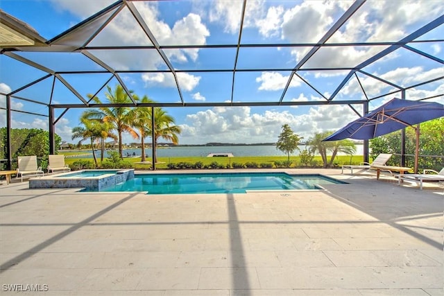 view of pool featuring a lanai, a patio area, and a pool with connected hot tub