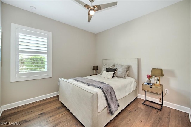 bedroom featuring dark hardwood / wood-style floors and ceiling fan