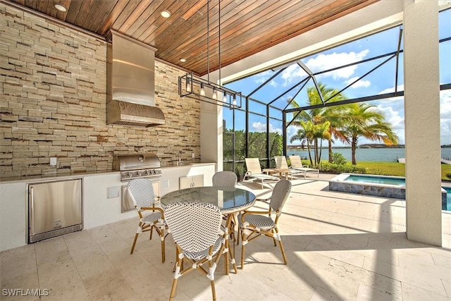 view of patio / terrace featuring glass enclosure, a water view, grilling area, and area for grilling