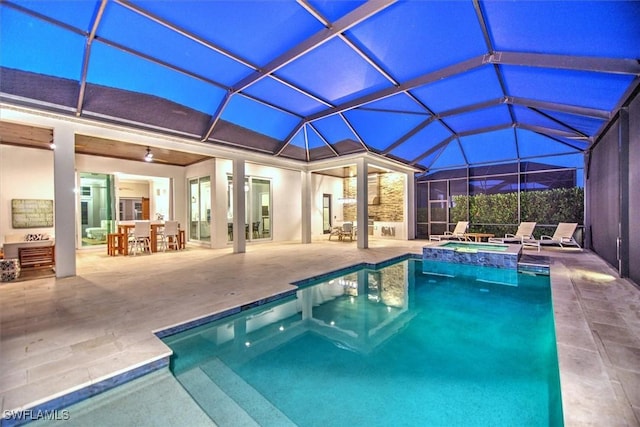 view of pool featuring an in ground hot tub, a lanai, a patio, and exterior bar