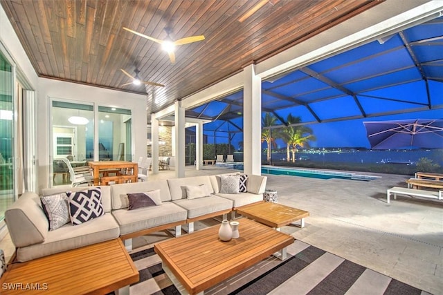 view of patio / terrace with glass enclosure, outdoor lounge area, and ceiling fan