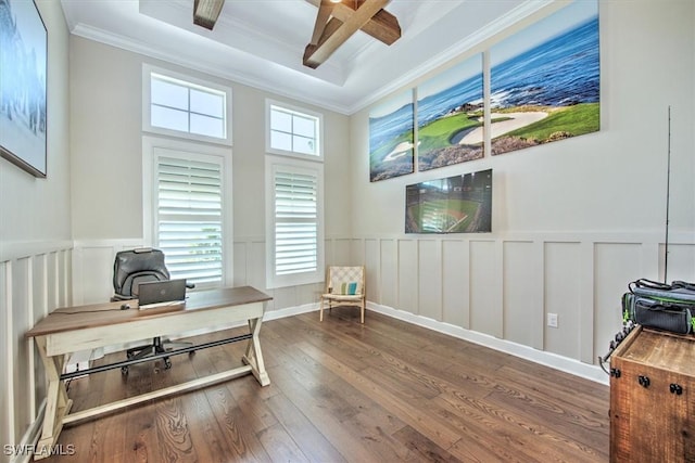 office area featuring hardwood / wood-style flooring, crown molding, a wainscoted wall, and ceiling fan