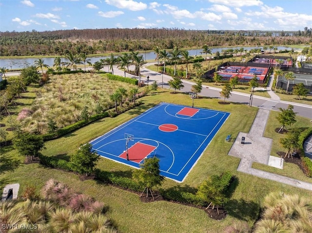 view of sport court with a water view