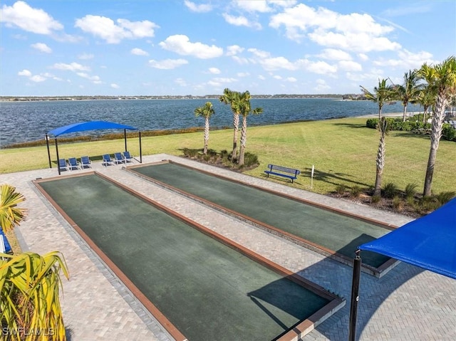 view of home's community featuring a yard and a water view