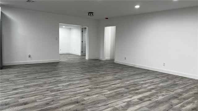 unfurnished room featuring hardwood / wood-style floors