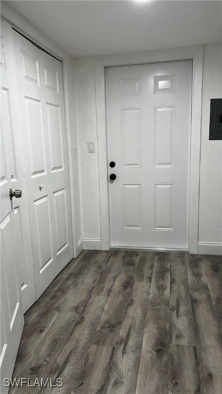 entryway featuring electric panel and dark hardwood / wood-style flooring