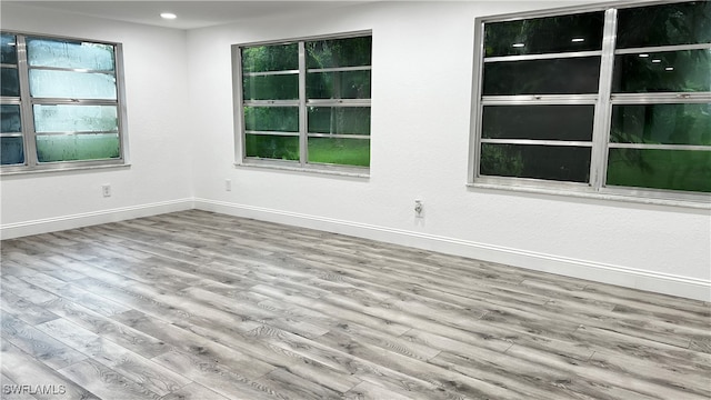 unfurnished room with light hardwood / wood-style flooring