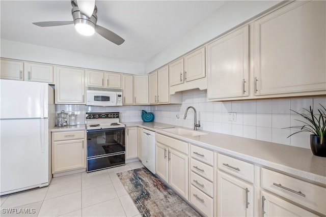 kitchen with decorative backsplash, sink, light tile patterned floors, and white appliances