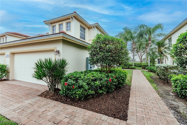 view of property exterior with a garage