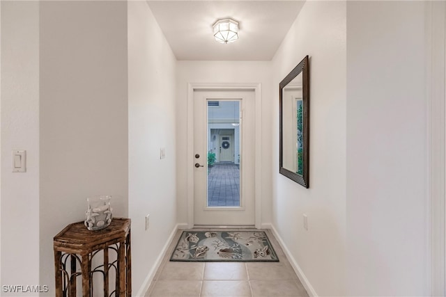 doorway to outside featuring light tile patterned floors