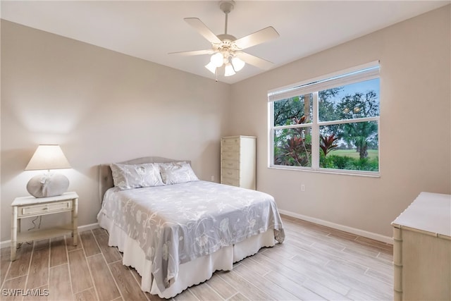 bedroom featuring ceiling fan and light hardwood / wood-style floors