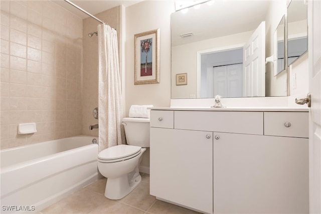 full bathroom featuring shower / bath combination with curtain, toilet, vanity, and tile patterned flooring