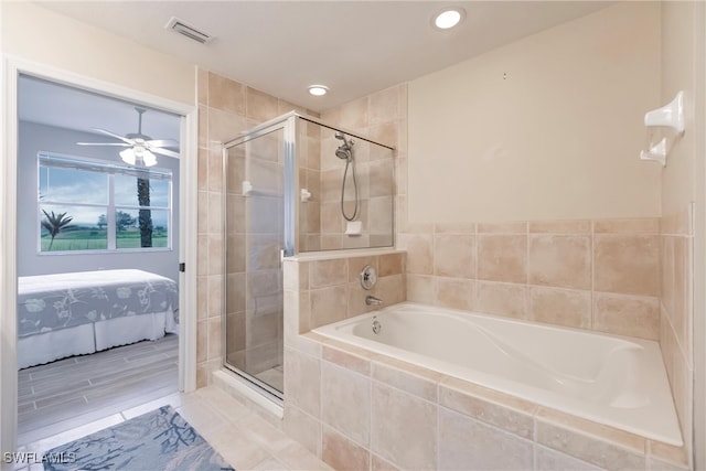 bathroom featuring ceiling fan and shower with separate bathtub