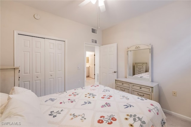 bedroom featuring ceiling fan, a closet, and light carpet