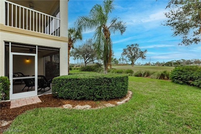 view of yard featuring a balcony