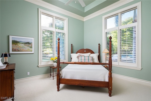 bedroom featuring crown molding, carpet floors, and ceiling fan